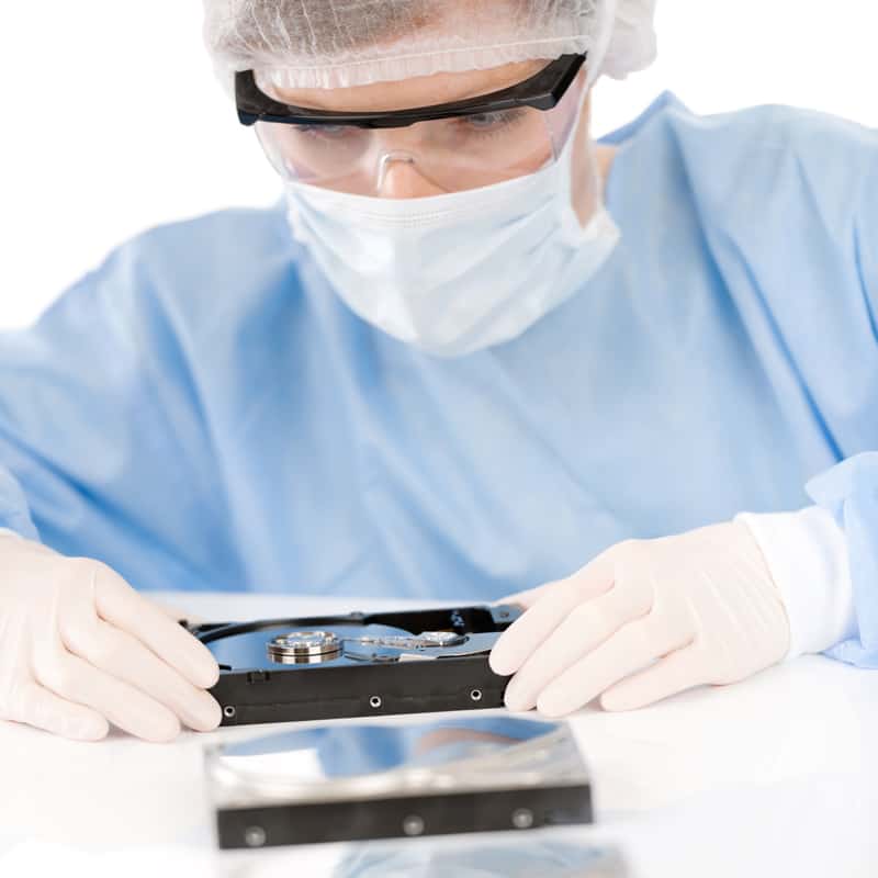 Technician working in a semiconductor cleanroom