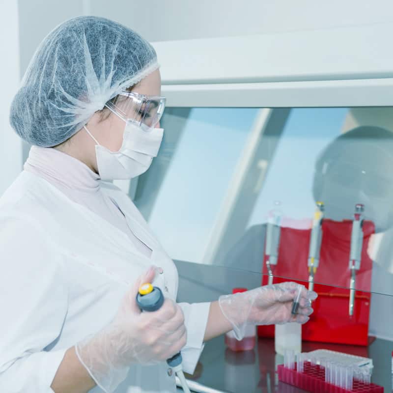 Medical professionals in a sterile hospital room
